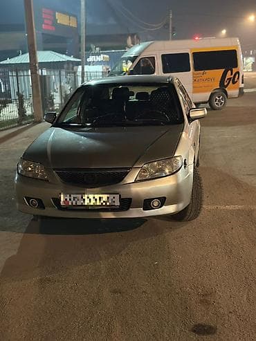Mazda 323: 2002 г., 1.6 л, Механика, Бензин, Седан