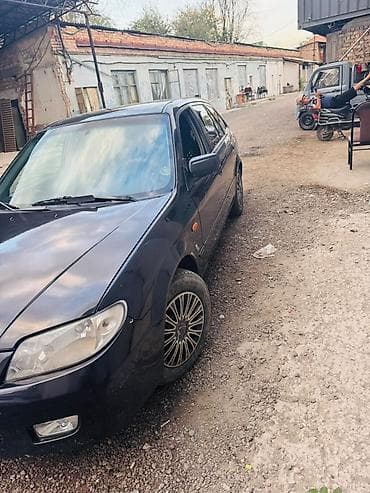 bcd com kg: Mazda 323: 2002 г., 1.6 л, Автомат, Бензин, Хэтчбэк — 2