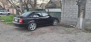 Mazda: Mazda Familia: 2000 г., 2 л, Автомат, Бензин, Седан — 2