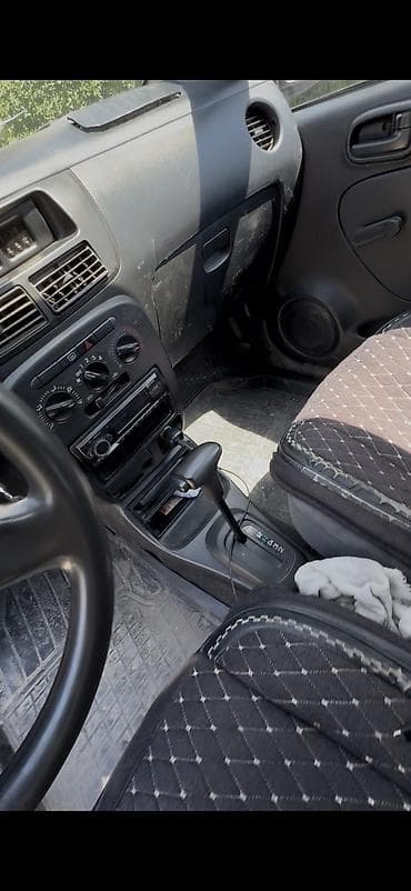 дайхатсу куеро: Daihatsu Cuore: 2003 г., 1 л, Автомат, Бензин, Хэтчбэк — 5