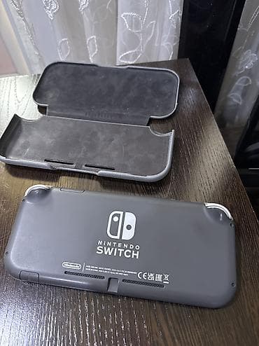 Nintendo: Nintendo Switch Lite, прошитая серый цвет. Особенности: - Портативная — 2