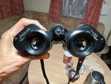 Бинокль Jaguar 7x50 с черным корпусом и ремешком для удобного ношения
