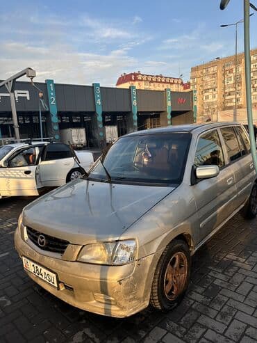 Mazda : 2002 г., 1.3 л, Автомат, Бензин, Универсал