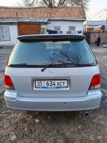 диск киа: Серебристый минивэн Honda Odyssey с характерным дизайном и — 6