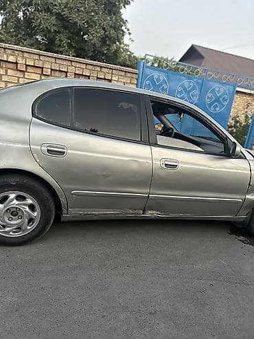 Транспорт: Daewoo Leganza: 1999 г., 2 л, Механика, Бензин, Седан — 7