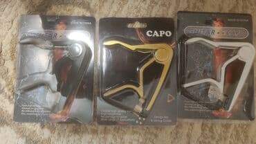 купить гитару в бишкеке бу: Каподастр есть в наличии: металлические и пластиковые . есть доставка — 5