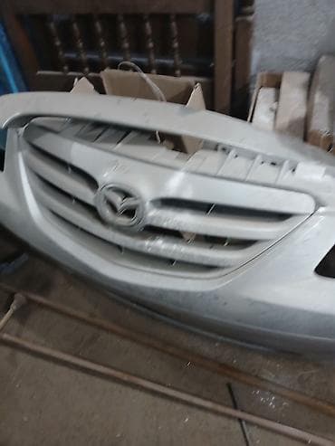 глаза на авто: Бампер Mazda, Оригинал — 1