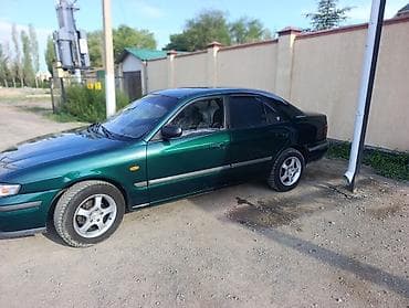 Унаа сатуу: Mazda 626: 1999 г., 1.8 л, Кол менен иштөөчү, Бензин, Седан — 5