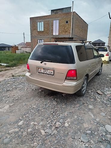 одесей: Honda Odyssey: 1999 г., Газ — 2