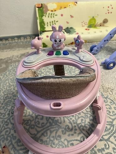 как новый: Детские ходунки Babywalker, розовые. - Круглая устойчивая база на — 2