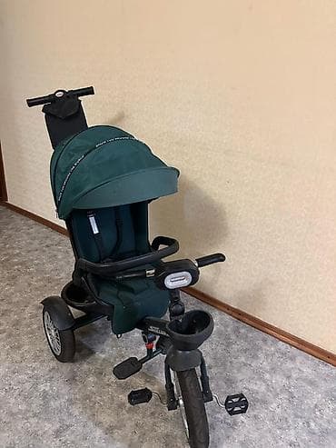 Детский трёхколёсный велосипед-коляска Stilumax (зеленый) -