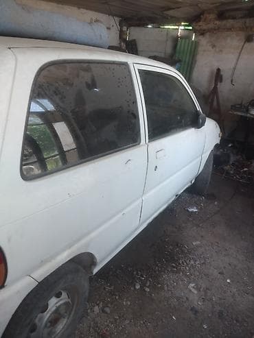 муравей с рулем: Daihatsu Cuore: 1995 г. — 4