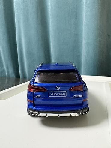 часы tag heuer: Коллекционная модель автомобиля BMW X5 xDrive40i (масштаб — 4