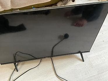 40: Телевизор TCL, диагональ около 32–40". Особенности и подключение: - — 4