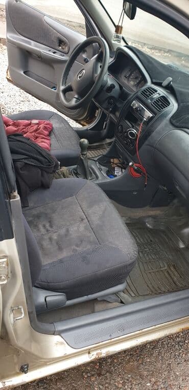 купить трактор бу мтз 82: Mazda 323: 2000 г., Механика, Бензин, Седан — 8