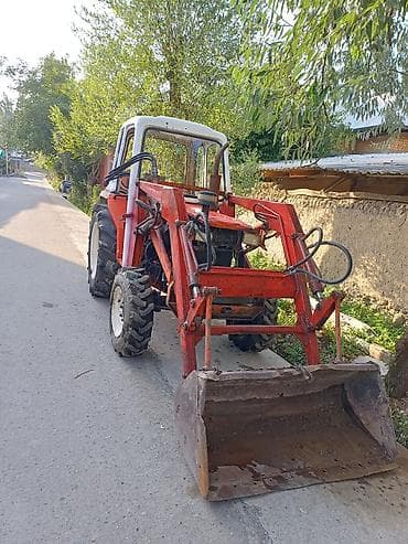 Фронтальный мини‑погрузчик на базе колесного трактора с кабиной — 1