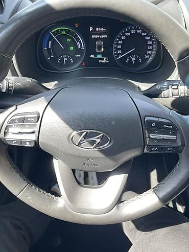 шильдик гибрид: Hyundai Kona: 2021 г., 1.6 л, Автомат, Гибрид, Кроссовер — 8