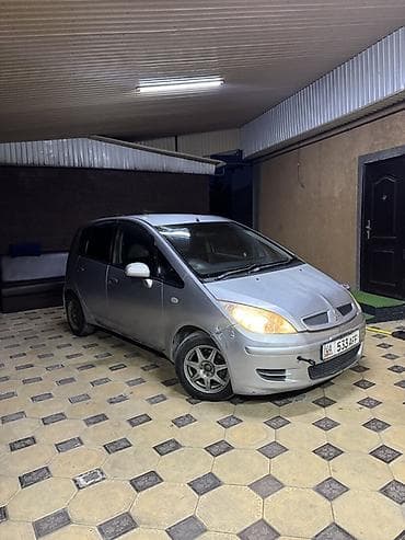 перекит руля: Mitsubishi — праворульный хэтчбек/минивэн, интерьер - Рулевое колесо — 10