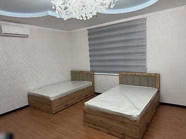 Односпальная кровать с мягким изголовьем и выдвижными ящиками -