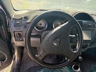 Унаа сатуу: Suzuki Ignis: 2004 г., 1.3 л, Кол менен иштөөчү, Бензин, Хетчбек — 6