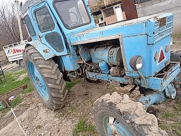 трактор т70: Трактор колесный, с кабиной, голубого цвета. Характеристики и — 1