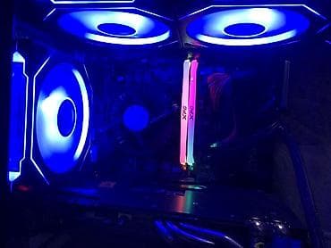 Игровой компьютер с RGB‑подсветкой в компактном стеклянном корпусе