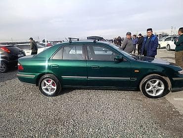 посадка авто: Mazda 626: 1997 г., 1.8 л, Механика, Бензин, Седан — 5