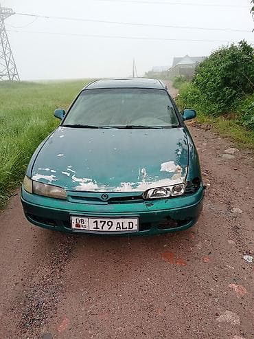 капот солярис: Mazda 626: 1992 г., Седан — 4