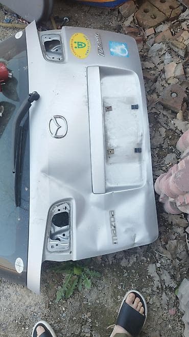 ддн 100: Крышка багажника Mazda — 1