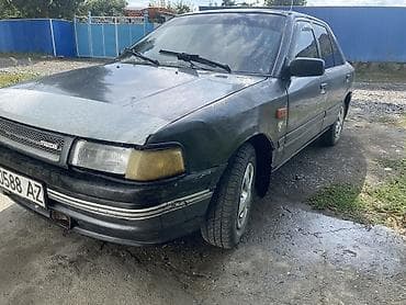 авто жак: Mazda 323: 1989 г., Кол менен иштөөчү, Бензин, Седан — 3