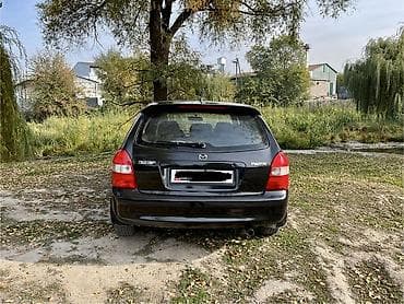4 5мм: Mazda 323: 2002 г., 1.6 л, Механика, Бензин, Хетчбек — 4