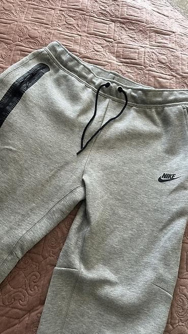 Спортивные штаны Nike - Модель: серые джоггеры с манжетами - — 1