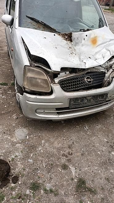 gilera runner: Opel Agila (первое поколение), серебристый хэтчбек, после фронтального — 3