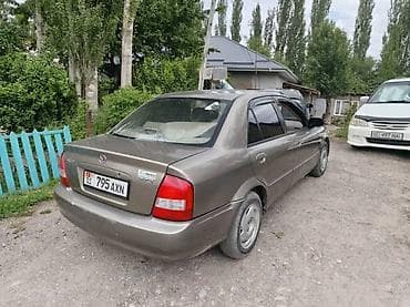 дверь мазда 323: Mazda 323: 2000 г., Автомат, Бензин, Седан — 2