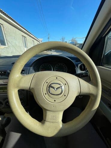 дом на обмен: Mazda Demio: 2003 г., 1.3 л, Автомат, Бензиновая, Хэтчбэк — 5
