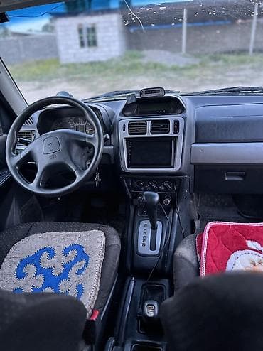 Унаа: Mitsubishi Pajero iO: 2004 г., 2 л, Автомат, Бензин, Жол тандабас — 9