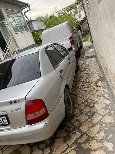 crv 5: Mazda 323: 2003 г., 1.4 л, Механика, Бензин, Седан — 4