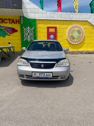 чекол машина: Suzuki Forenza: 2009 г., 2 л, Автомат, Бензин, Седан — 6