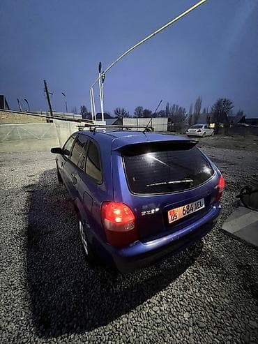 кытай мото: Mazda 323: 2000 г., 2 л, Кол менен иштөөчү, Дизель, Хетчбек — 4