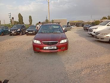mini clubman: Mazda 323: 2003 г., Универсал — 1