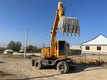 покрышка на погрузчик цена: Экскаватор, Колесный — 6