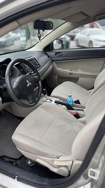 королла 2015: Mitsubishi Lancer: 2015 г., 2 л, Автомат, Бензин, Седан — 7