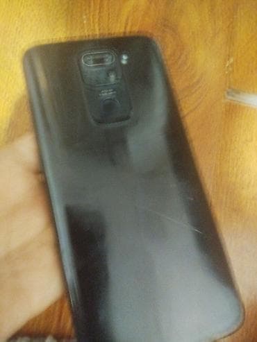 web camera: Смартфон с задней крышкой черного цвета и сканером отпечатка пальца на — 1