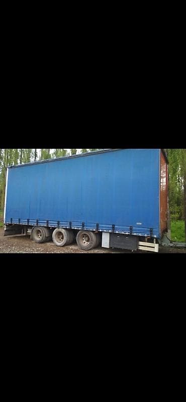 накопительный бачок: Тентованный автопоезд для дальних грузоперевозок - Тягач: Volvo FH — 4