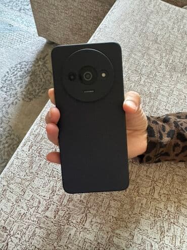 телефон арзан баада: Смартфон на Android с большим экраном и круглым модулем камеры — 1