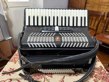 обучение фортепиано: Аккордеон Parrot (кнопочно-клавишный) Описание: - Корпус черного — 8