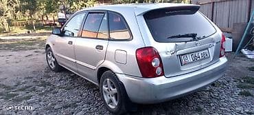 кассеты аудио: Mazda 323: 2002 г., 1.3 л, Механика, Лифтбек — 3