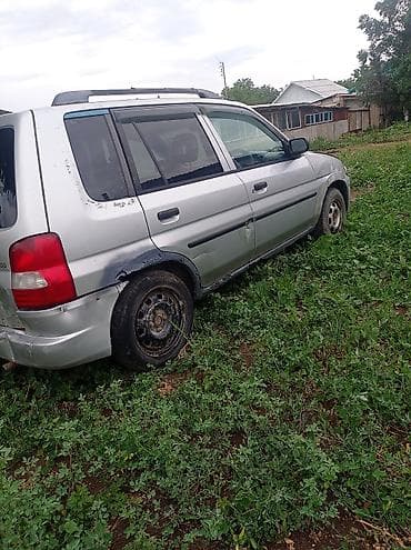сктер: Mazda Demio: 1998 г., 1.3 л, Автомат, Бензин, Универсал — 2