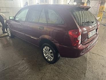 мицубиси колт: Mazda 323: 2002 г., 1.5 л, Механика, Бензин, Хэтчбэк — 4