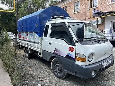 ручной машина: Hyundai Porter — компактный бортовой грузовик с тентованным кузовом — 1